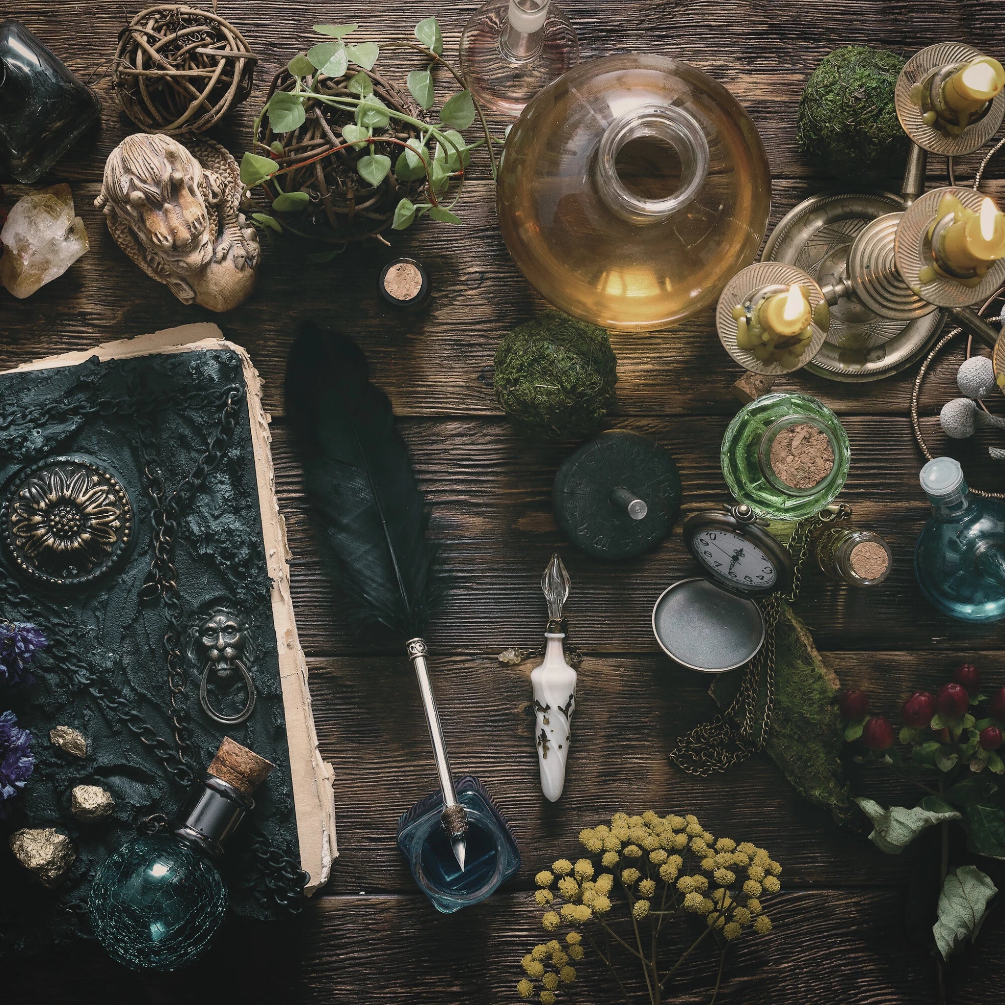 A selection of items for all your witchy needs, including potion bottles, candles, quill and book of shadows