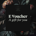 A digital gift card from The Little Witch with floral backgrounds, featuring the text 'E Voucher A gift for you'.