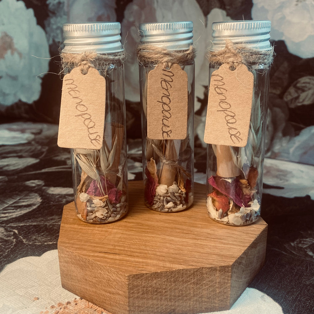 Carefully selected variety of preserved flowers, herbs and foliage along with a handwritten scroll holding affirmations to support the transition of peri and menopause 