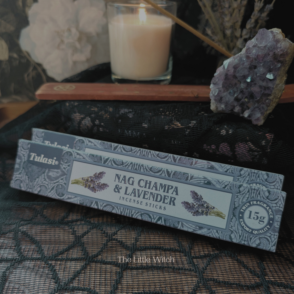Nag Champa & Lavender incense sticks packaging with a candle and crystals in the background.