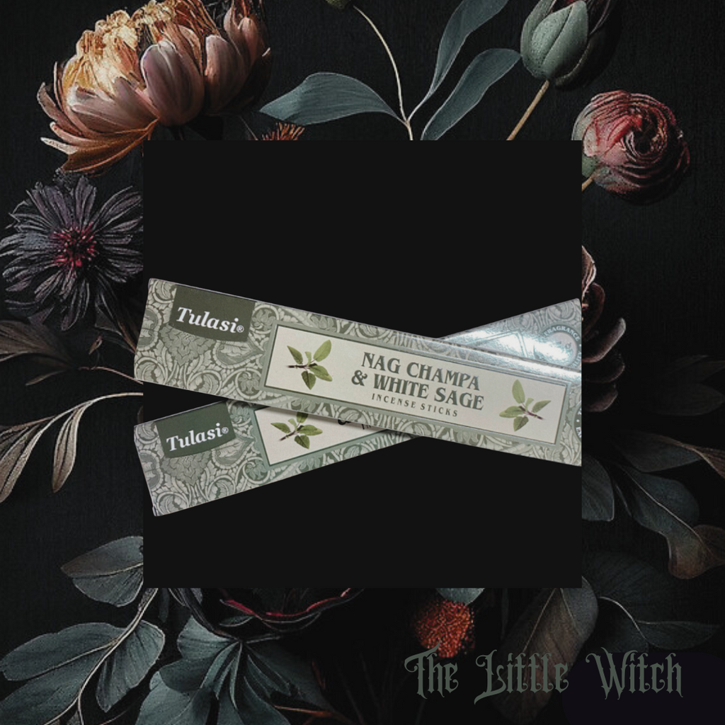 A box of Tulasi brand Nag Champa and White Sage incense sticks, placed on a surface with floral elements.