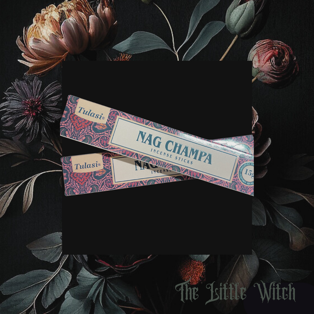 A pack of Nag Champa incense sticks placed on a dark surface with floral designs around, under a floral backdrop.