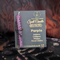 Purple beeswax candle mounted on a branded The Little Witch black and gold card