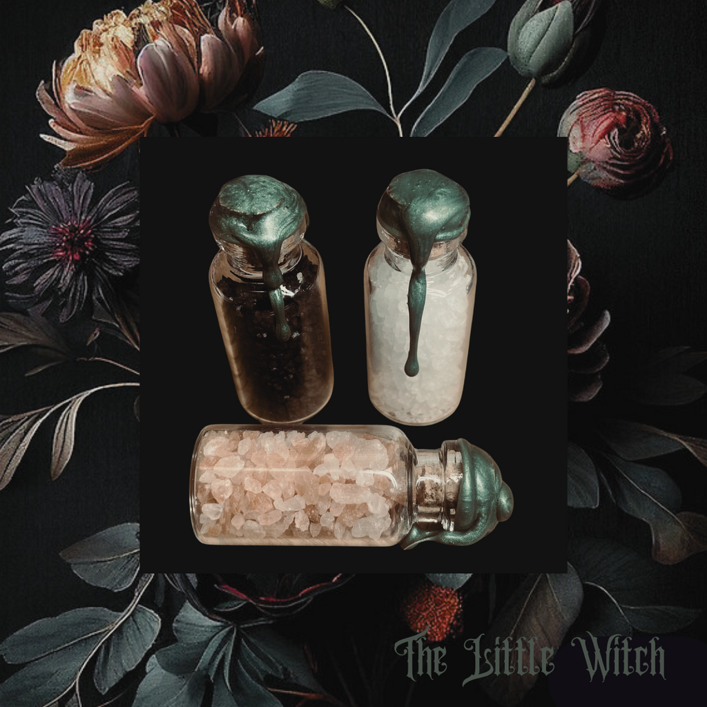 A hand holding a clear tube with a label that reads 'Fertility', containing herbs and flowers for a fertility spell. The tube is sealed with a piece of paper with an affirmation message.