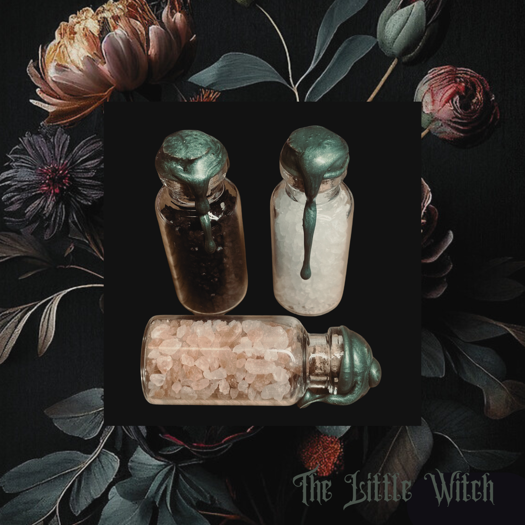 A hand holding a clear tube with a label that reads 'Fertility', containing herbs and flowers for a fertility spell. The tube is sealed with a piece of paper with an affirmation message.