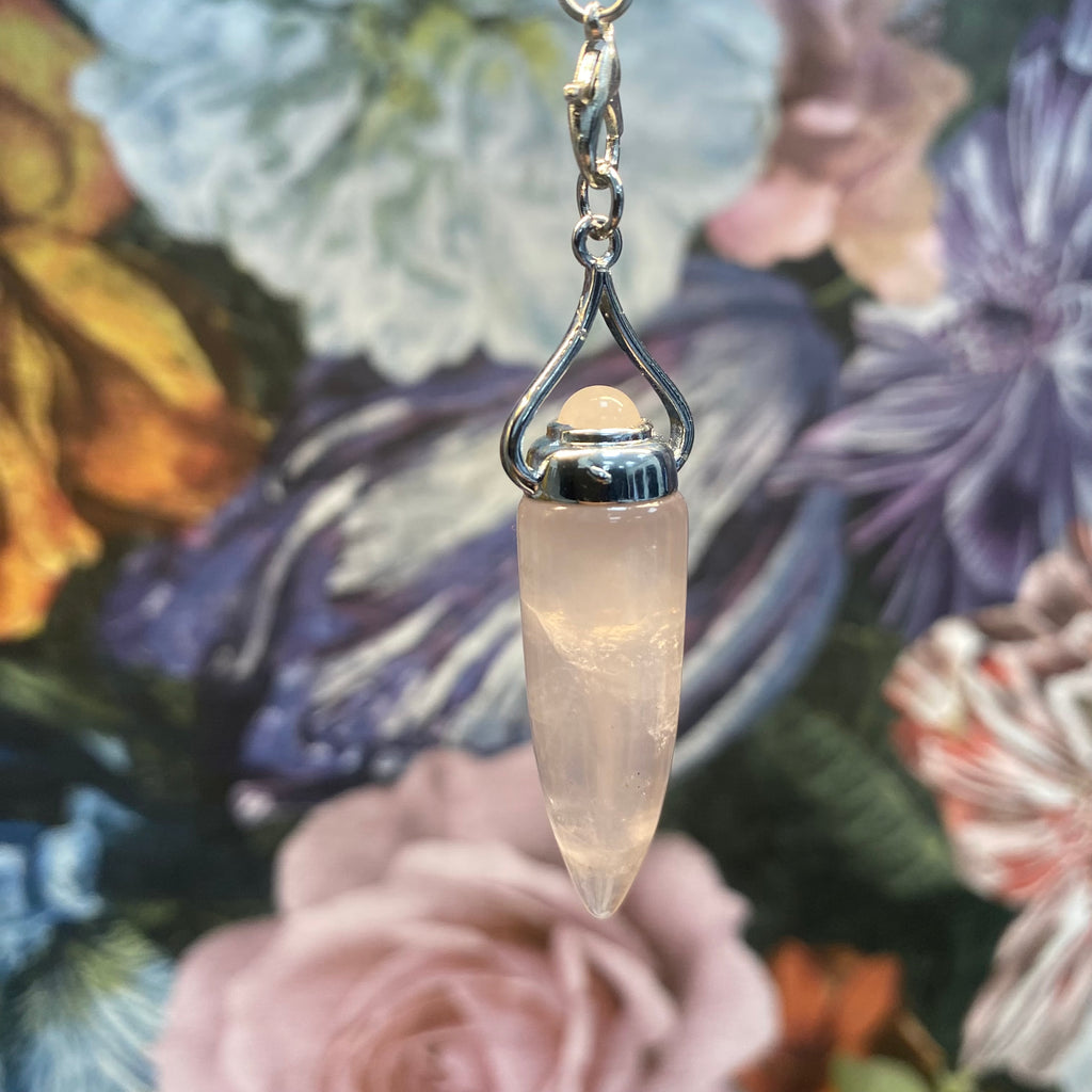 Rose Quartz cone pendulum with floral background