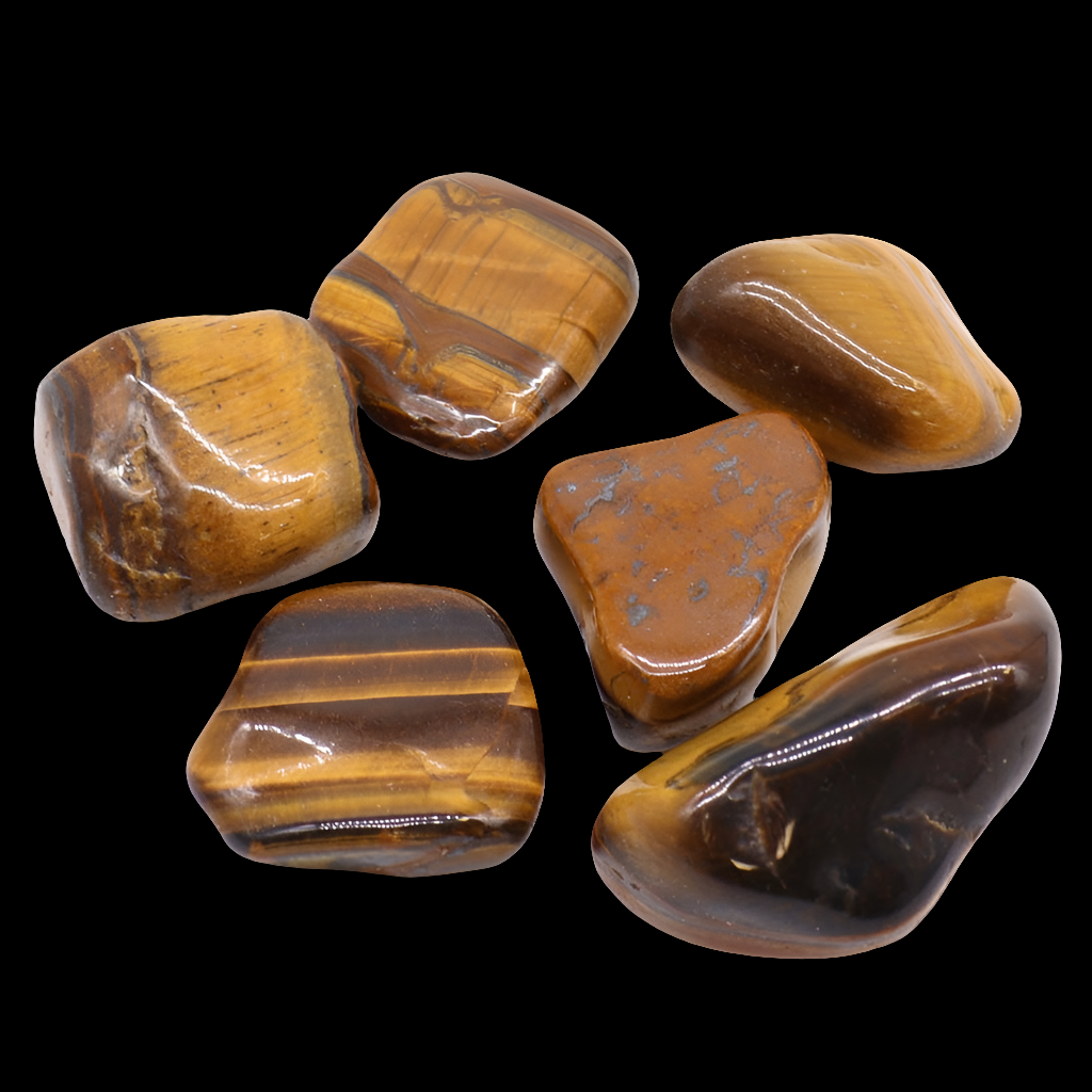 A selection of tigers eye crystals on a black background