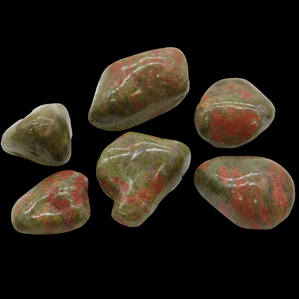 a selection of unakite crystals on a black background