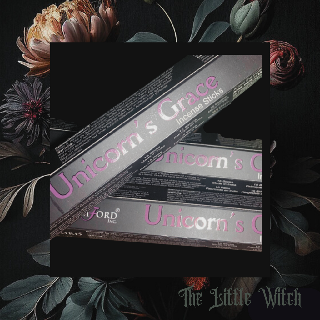 A package of Unicorn's Grace incense sticks displayed with floral elements in the background, branding visible.