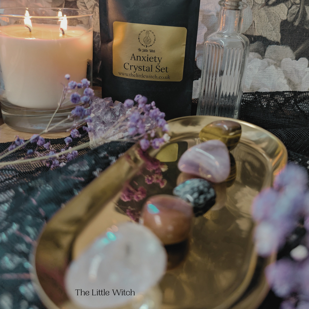 Crystal set and candle on a witchy table setting