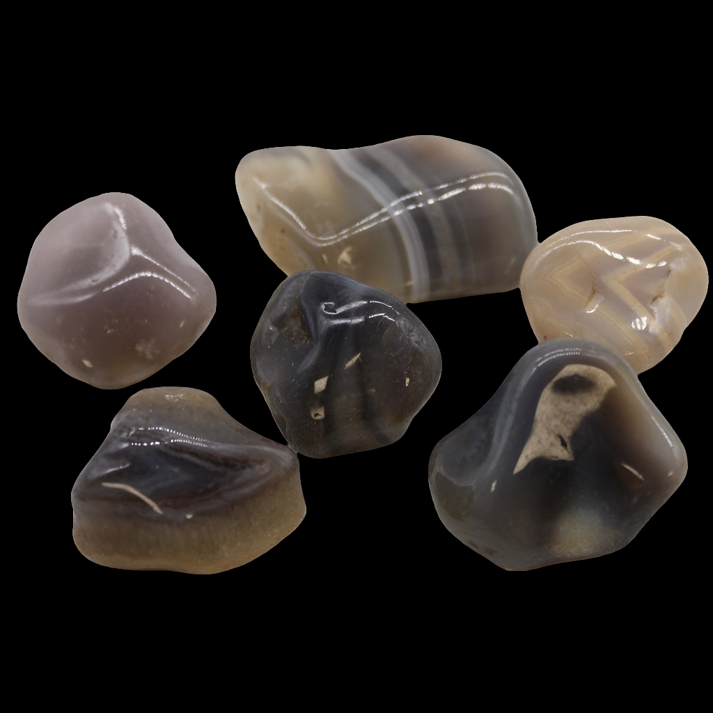 black background with a selection of 6 botswana agate crystals