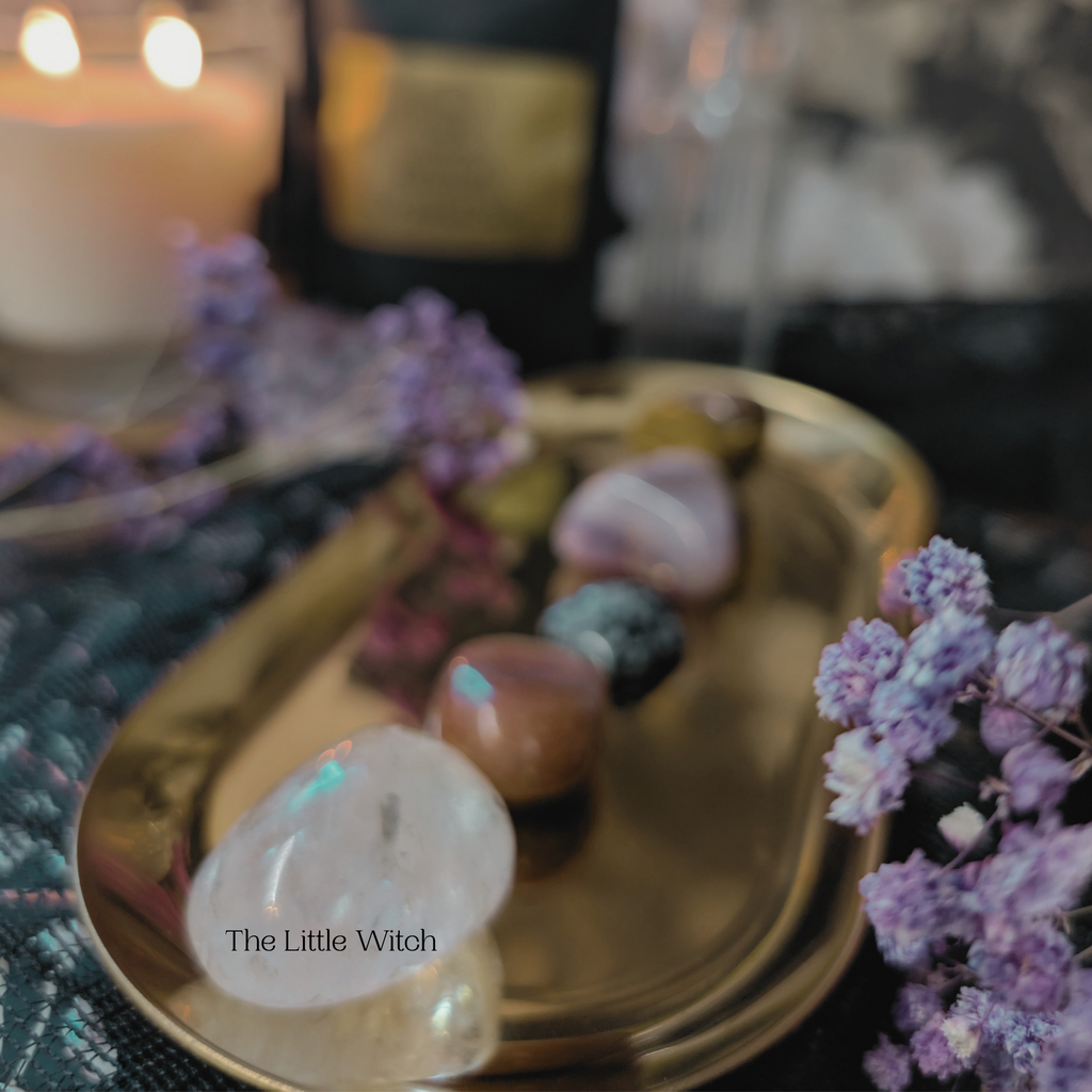 Decorative tray with stones and lavender on a mystical background.