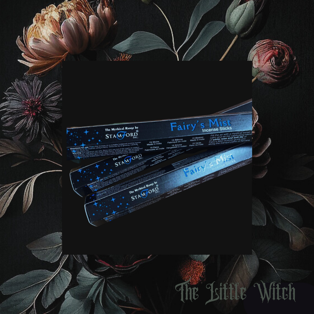 A pack of incense sticks labeled 'Fairy's Mist' from The Little Witch brand, displayed with floral elements in the background.