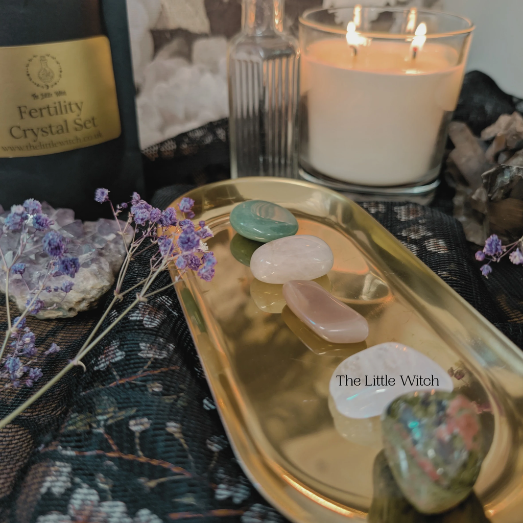 Crystal set and candle on a textured surface