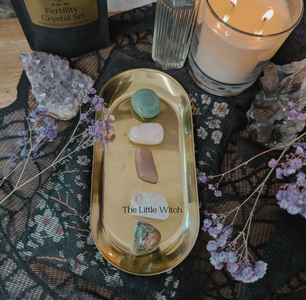 Gold tray with witchcraft items on a decorative surface