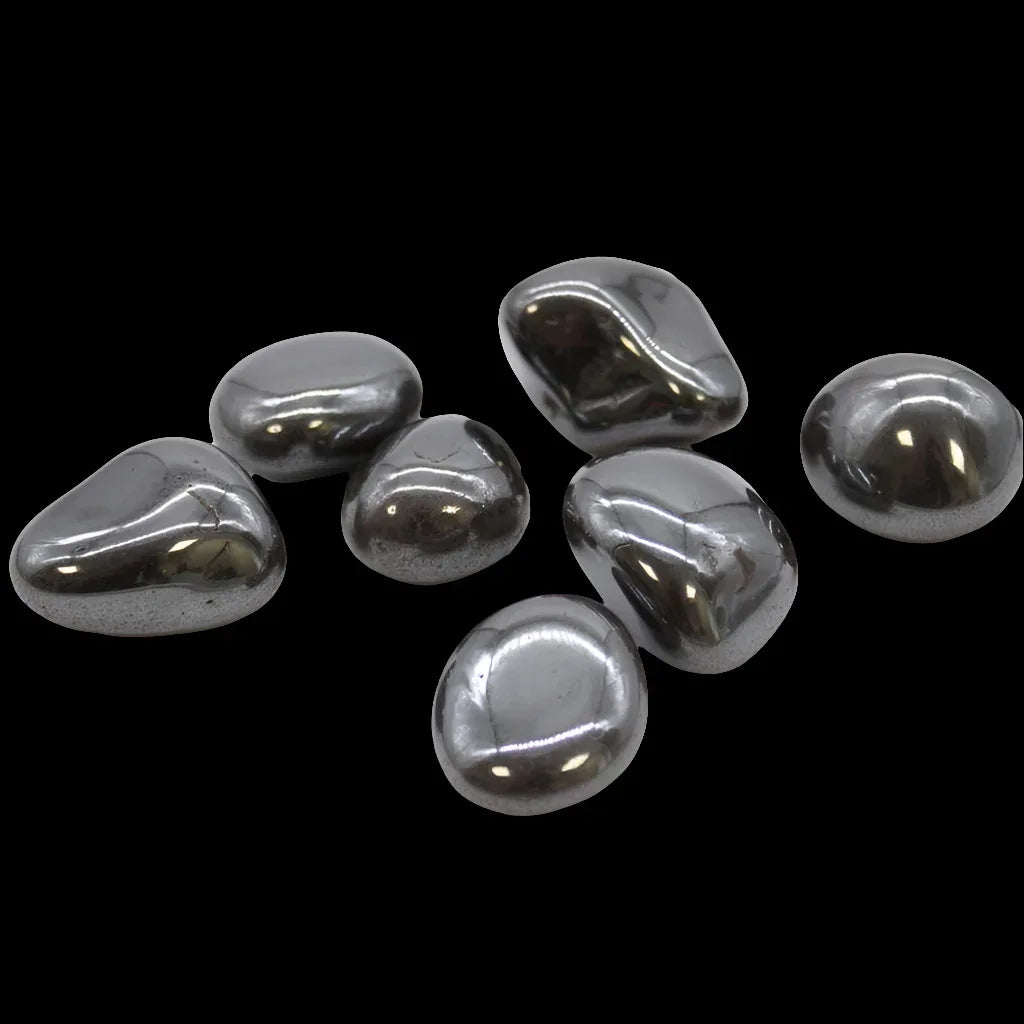 Silver metallic pebbles on a black background