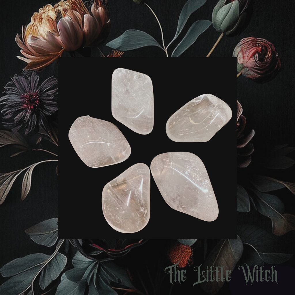 A collection of tumbled clear quartz crystals displayed on a dark background surrounded by floral elements.