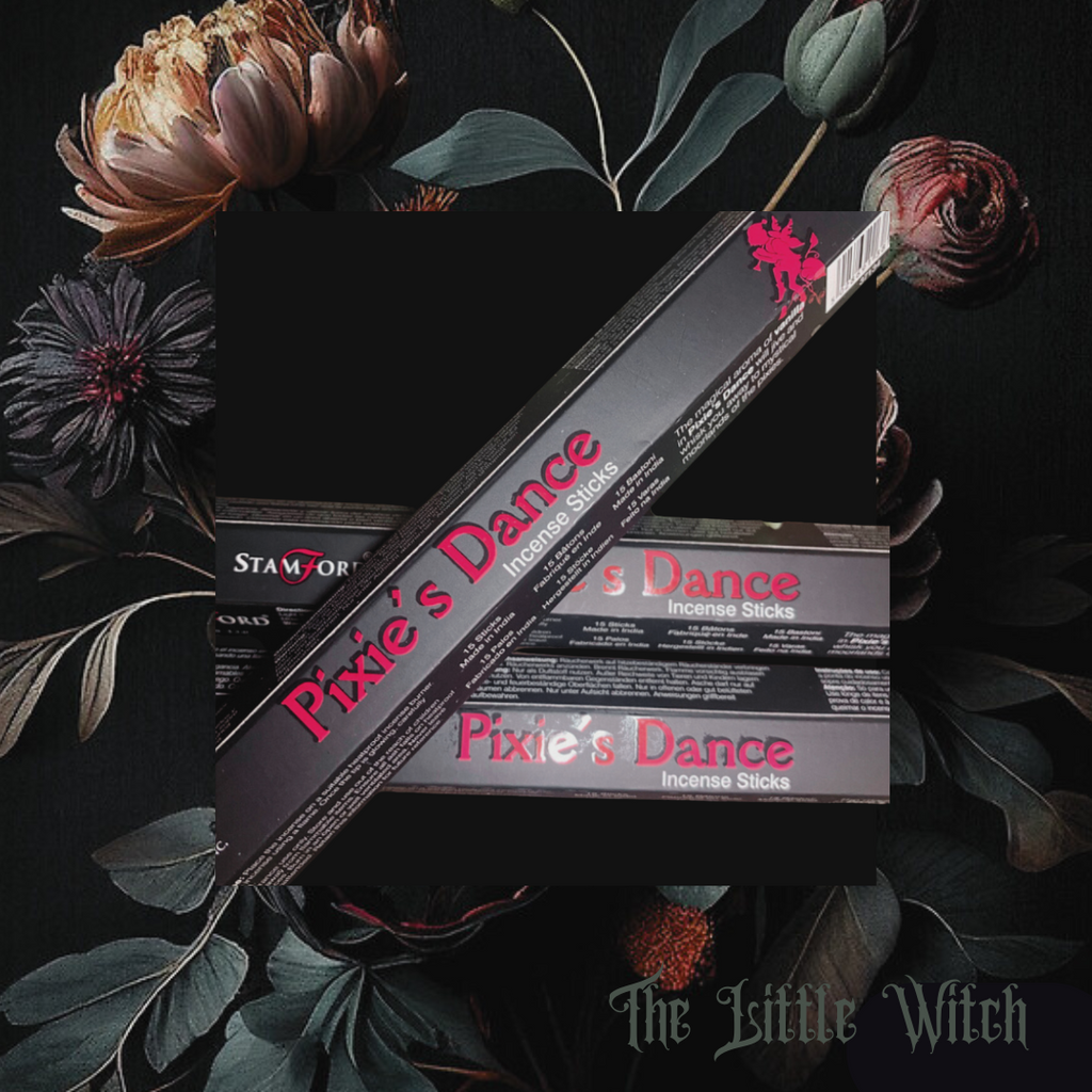 A box of Pixie’s Dance incense sticks displayed with floral elements in the background, emphasizing the mystical and natural theme.