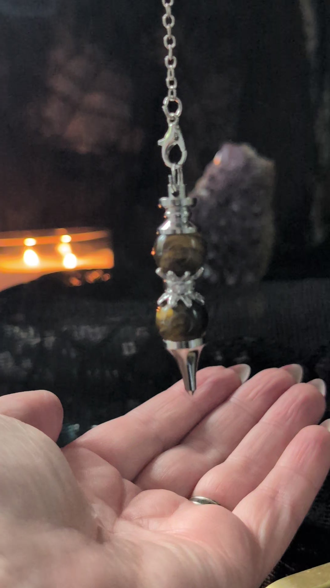 A clip of the double tiger eye pendulum answering yes or no questions 