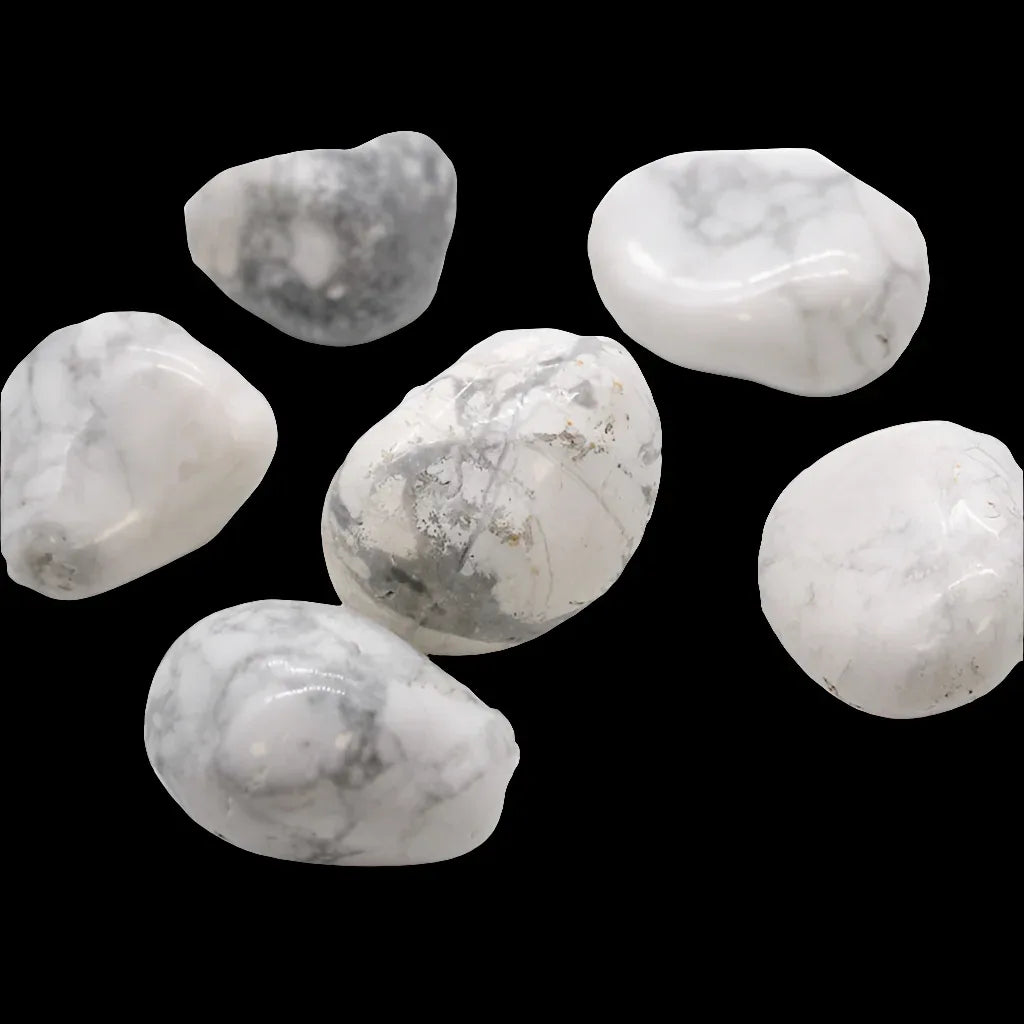 White and gray marbled stones on a black background